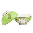 Deux bols verts Maneki Neko : décor extérieur et intérieur blanc.